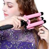 Hair curler with triple barrel iron