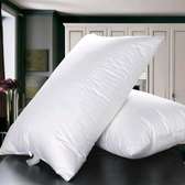 COMPRESSED FIBRE FILLED BED PILLOWS