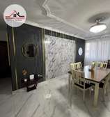 Black flutted panels with granite center interior design