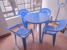 Plastic Round table and 4 plastic chair set.