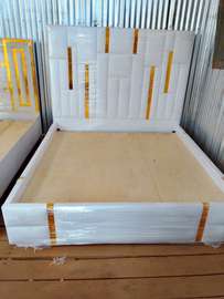 Modern White Bed Frame with Gold Accents & Padded Headboard