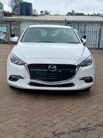 Mazda Axela white color Sedan 2019 model.