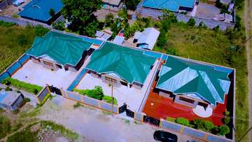 3 Modern Homes with Green Metal Roofs in Gated Compound