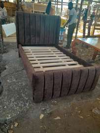 Elegant Grey Upholstered Bed Frame with Gold Accents
