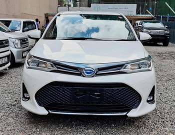 Toyota AXIO WXB white color hybrid 1500cc 2018 model.