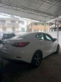 Mazda Demio sedan white