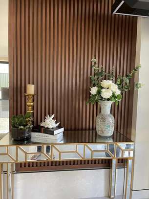 Brown accent wall fluted panels image 3