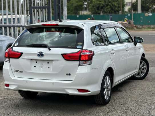 Toyota Fielder hybrid Pearl white color 2018 model . image 4
