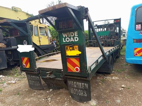 Local Canter ,,with flatbed for towing a crane and towing image 3