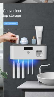 Electric toothbrush UV sterilization dispenser image 1