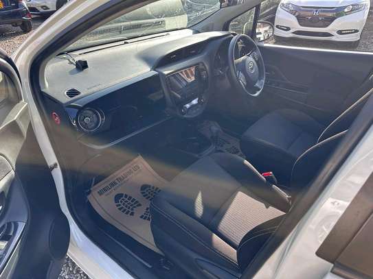 Toyota vitz hybrid white color 2019 model fully loaded image 9