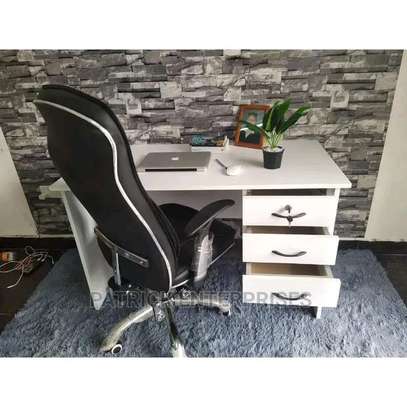 White office table with an adjustable leather chair image 1