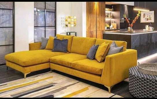 L shape sofa with bouncy cushions and lower wooden skirting image 3