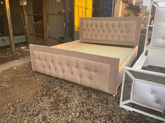 Hard wood 5x6 chesterfield bed image 1