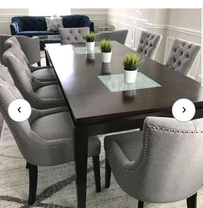 Wooden dining table with 8 chairs image 1