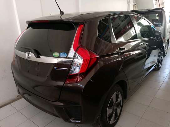 Honda fit hybrid maroon image 10