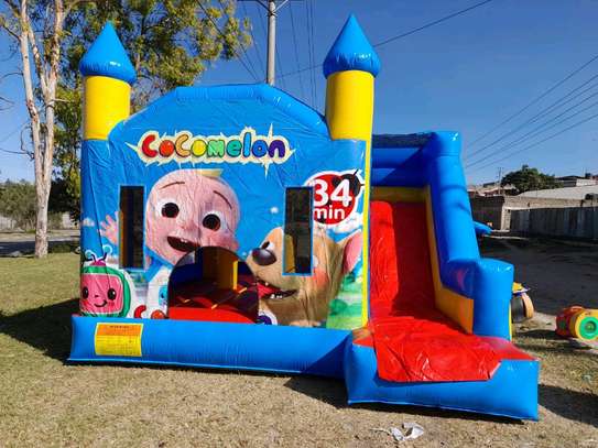 Boys' bouncing castles available for hire image 1