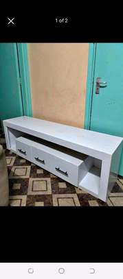 Tv stand with 3 sets of drawers image 1