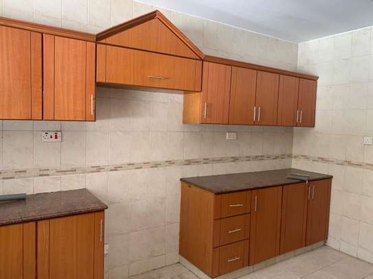 3 bedroom apartment master Ensuite with a cloakroom image 13