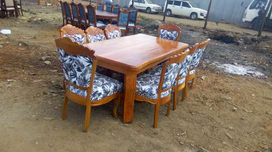 Dinning table with 8 chairs image 1