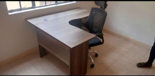 L shaped desk with a headrest chair image 1