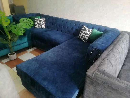 L shaped Tufted sofa image 1