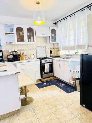 Modern Airbnb Apartment with Bright Kitchen & Open Living image 2