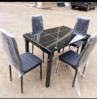 Home dining table with black chairs image 1