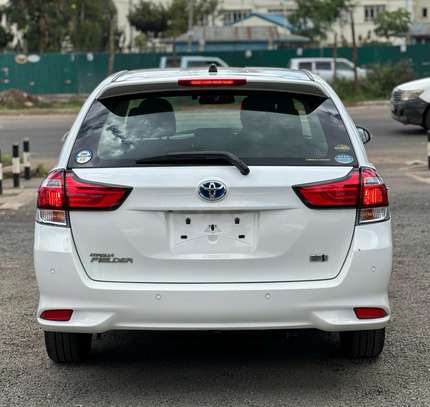 Toyota Fielder hybrid Pearl white color 2018 model . image 1