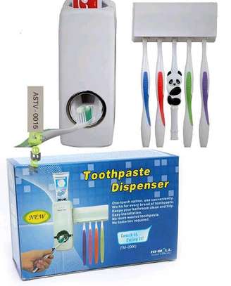Toothpaste Dispenser plus toothbrush holder image 1