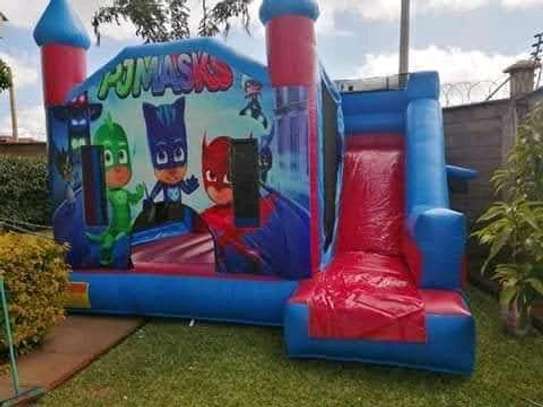 Boys' bouncing castles available for hire image 4