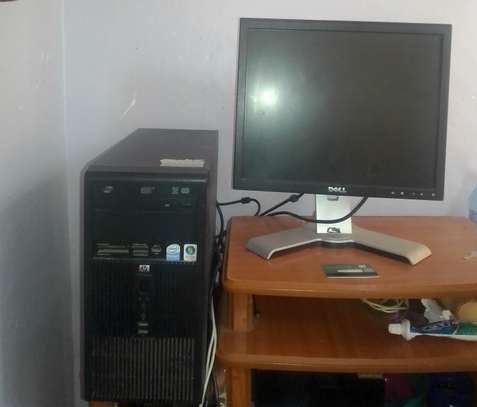 Desktop,printer and TCL tv image 1