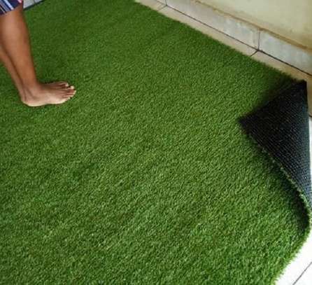 Verdant environment on artificial grass carpet image 1