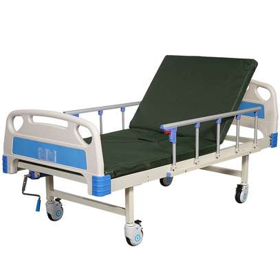 single crank hospital bed with mattress and drip stand image 2