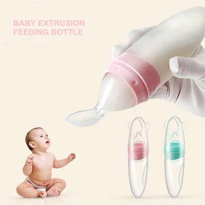 Silicone feeding bottle with a spoon image 1