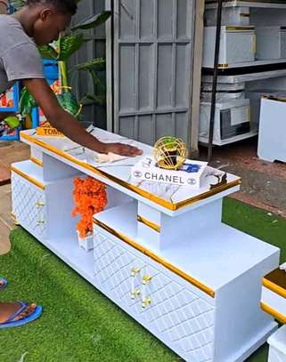 Tv Stand with golden ribbons decorations image 2