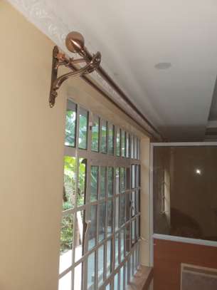 Expert curtain rods and mosquito net installation image 1
