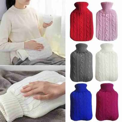 Hot water bottle with knitted cover image 1