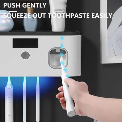 Electric toothbrush UV sterilization dispenser image 3