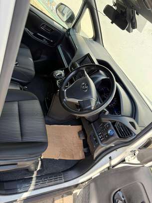 White Minivan with Modern Grille & Roomy Interior  2019 image 11