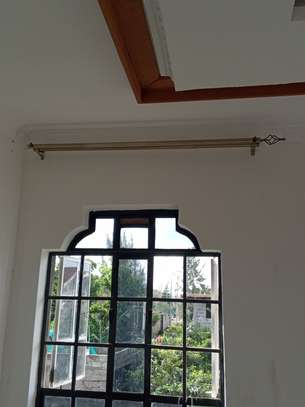 Expert curtain rods and mosquito net installation image 2