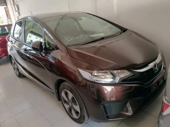 Honda fit hybrid maroon image 1