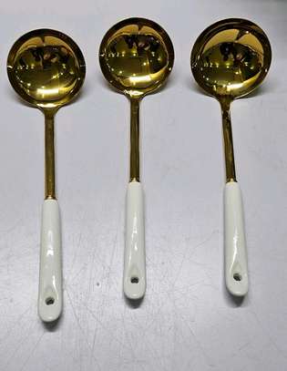 Single golden serving spoon image 10
