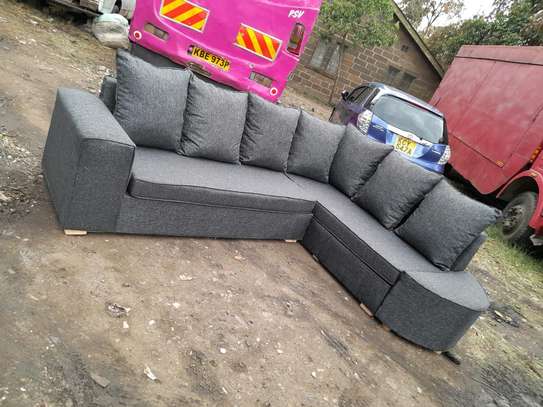 L shape of gray with pillows hard frame cushion high density image 1