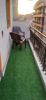 Outstanding balcony using artificial grass carpet image 1