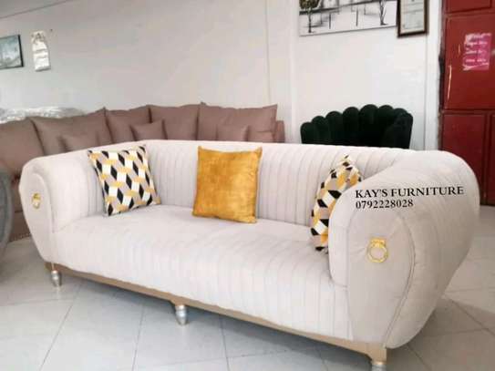 3 seater trendy sofa with gold rings image 1