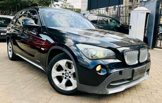 BMW X1 Year 2012 black colour very clean image 1