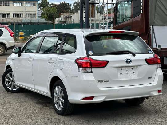 Toyota Fielder hybrid Pearl white color 2018 model . image 10