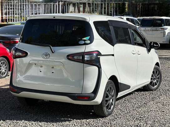 Toyota Sienta perl white color fully loaded 2019 model. image 3