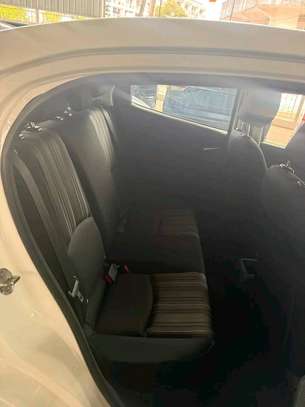 Mazda Demio sedan white image 4